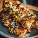Delicious Chicken Skewers with Garlic and Parmesan, plated and ready to eat. Close-up shot.
