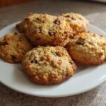 A plate of freshly baked Protein Greek Yogurt Cookie with visible chocolate chips.