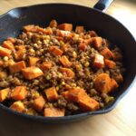 A skillet filled with Sweet Potato and Ground Turkey, also containing corn. Ready to serve.
