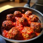 Pan of Homemade Meatballs with Sauce, simmering in a rich tomato sauce.