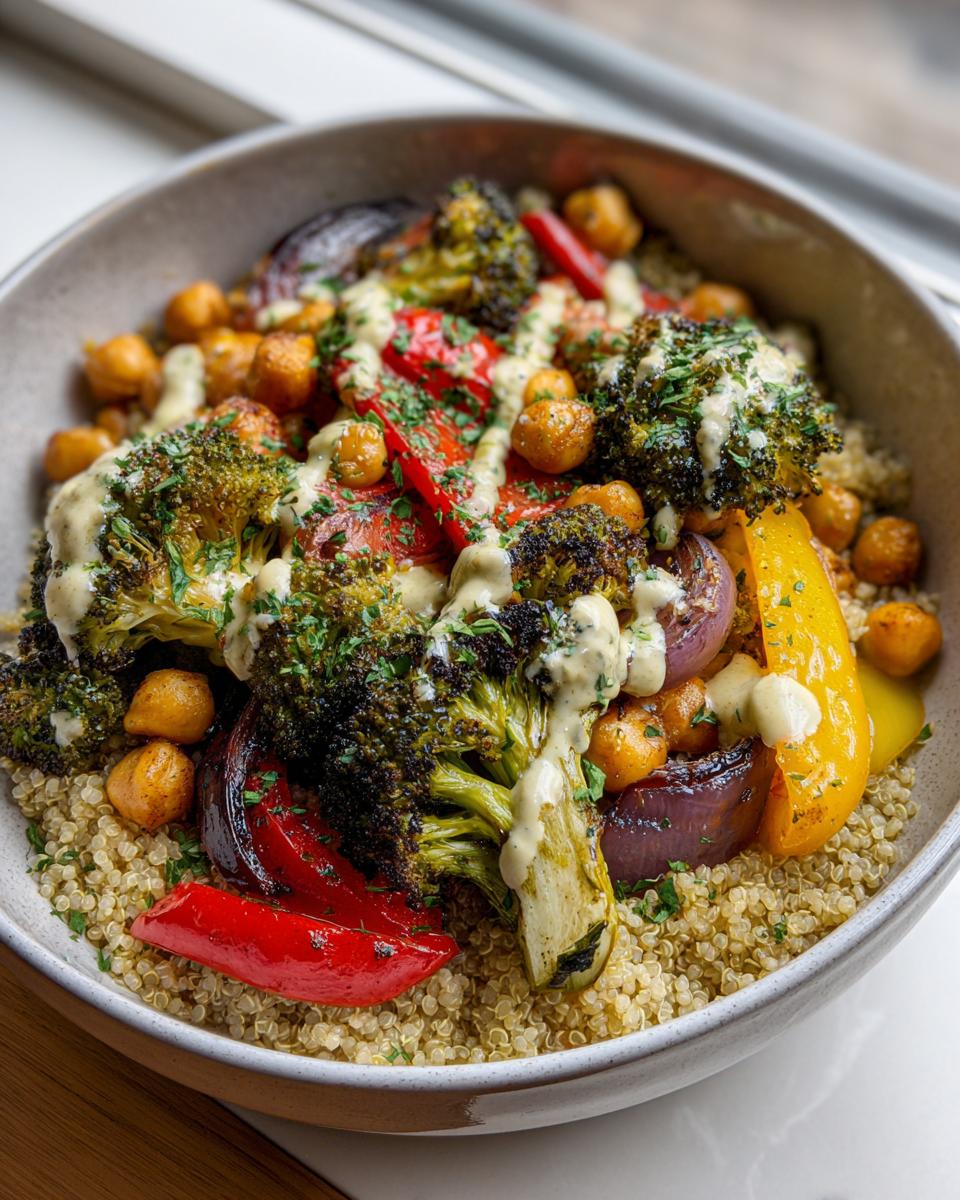 A vibrant Quinoa and Veggie Power Bowl with roasted broccoli, peppers, chickpeas, and a creamy sauce.