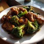 Close-up of glazed chicken pieces mixed with bright green broccoli florets, perfect for Easy Weeknight Dinners.