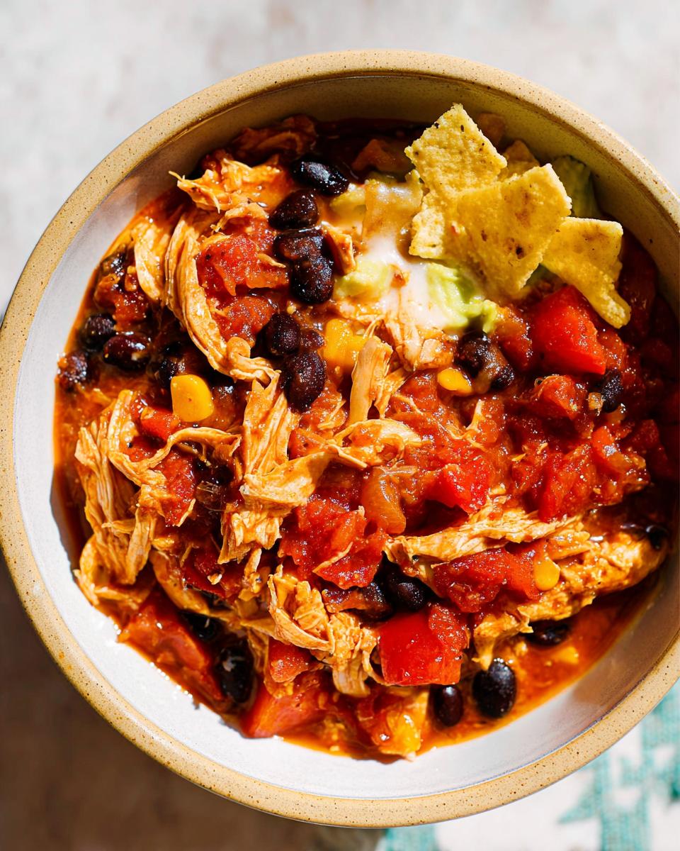 Close-up of shredded chicken chili with black beans, tomatoes, and avocado, perfect for Instant Pot Weeknight Winners.