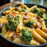 A bowl of cheesy pasta with broccoli florets and sausage pieces, a perfect easy dinner recipe.