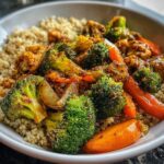 A close-up of a nutritious homemade meal featuring broccoli, carrots, cauliflower, and quinoa, perfect for everyday energy.