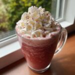 A refreshing Starbucks secret menu drink, blended with ice and topped with whipped cream and a sprinkle of dark topping.